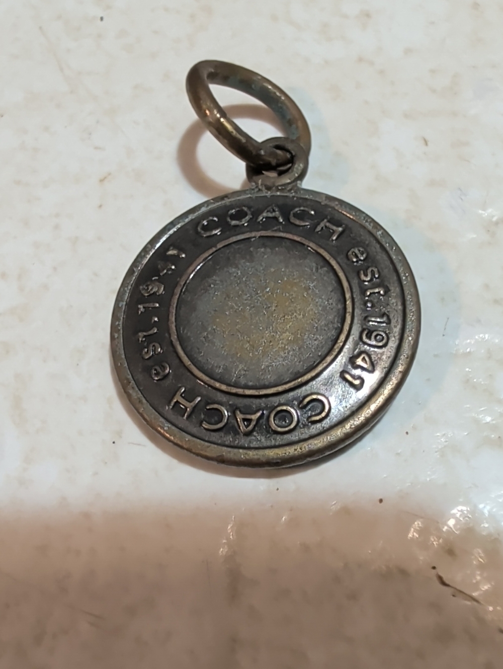 Coach Round Metal Pendant Charm in Aged Silver Tone